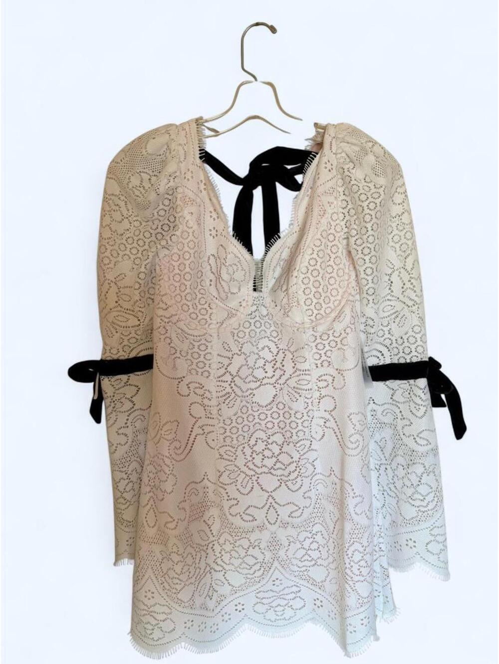 Cream lace long sleeve dress with black bow tie and back cut out